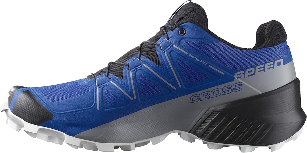 Lapis blue and black trail running shoes with aggressive sole lugs and mesh upper, ideal for off-road running.