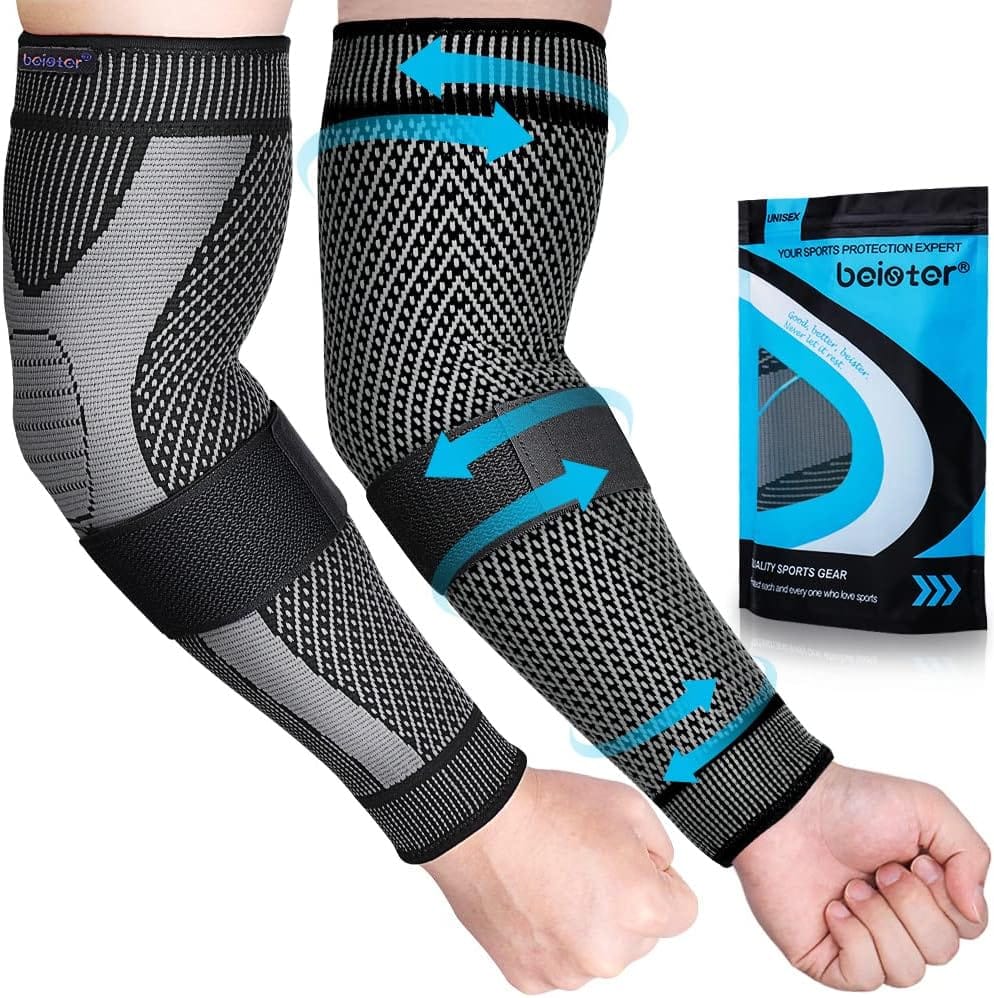Pair of black and grey beister compression arm sleeves with blue elastic straps, shown on arms with packaging in background.
