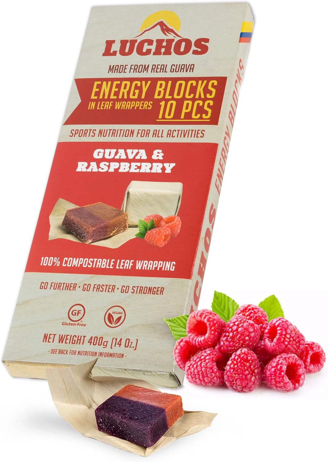 Box of LUCHOS Guava & Raspberry energy bars with compostable leaf wrappers, shown with fresh raspberries and unwrapped bar pieces.