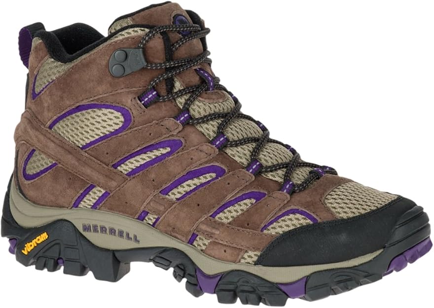 Side view of Merrell Women’s hiking boot in brown and purple tones, featuring Vibram sole and mesh panels.