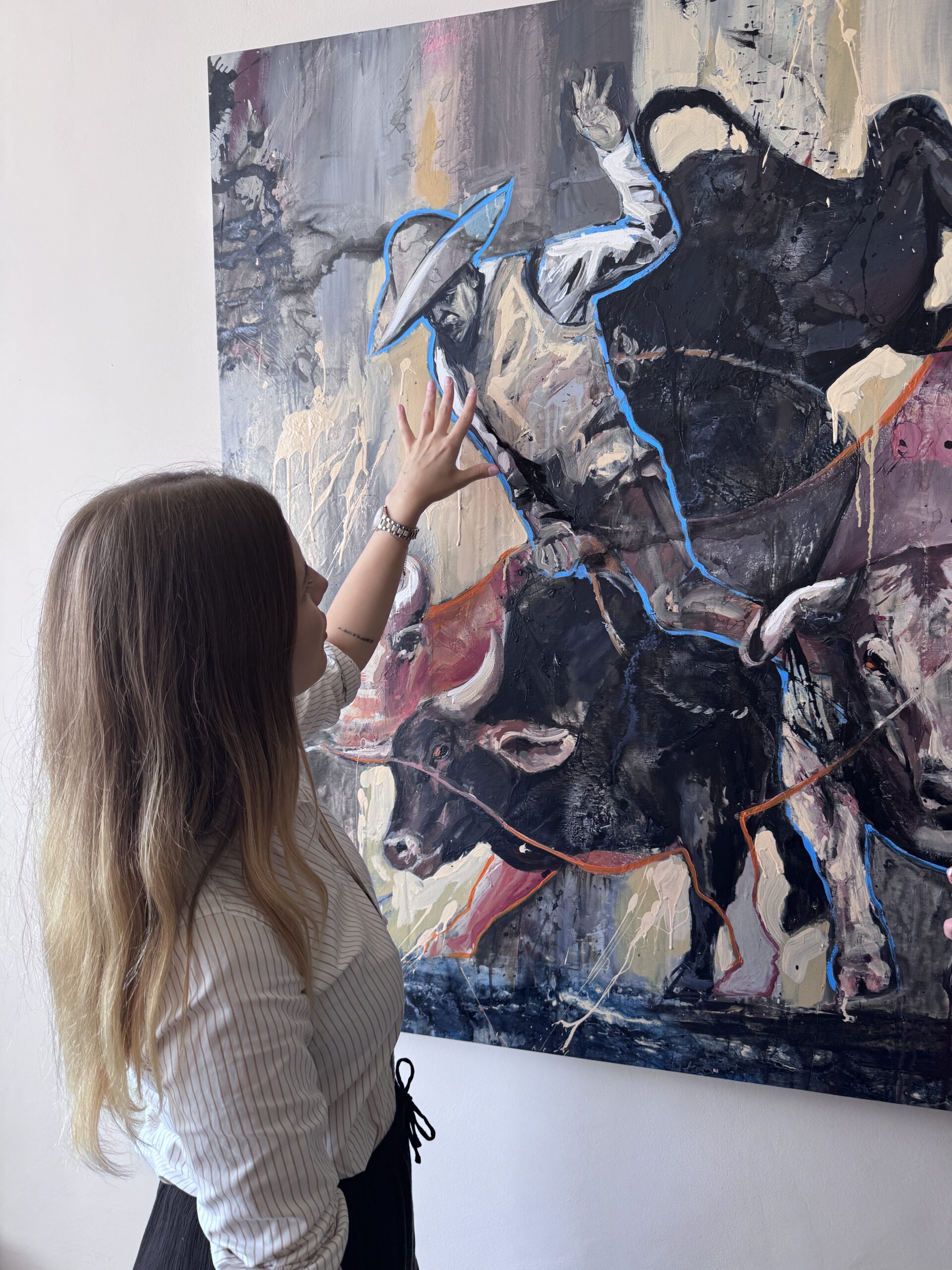 Velena Nikolova admiring a SILVI The Artist painting