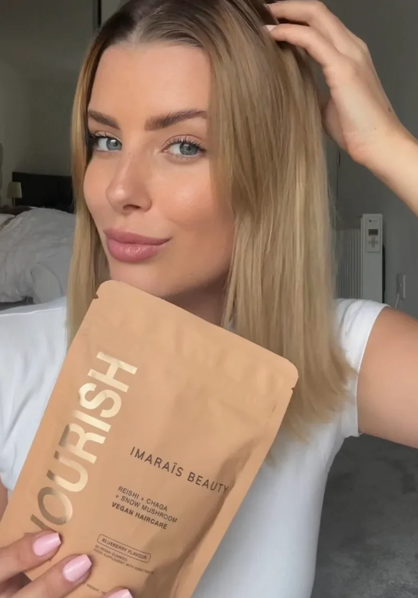 E-commerce UGC showing a content creator holding a beauty supplement product in a natural at-home setting